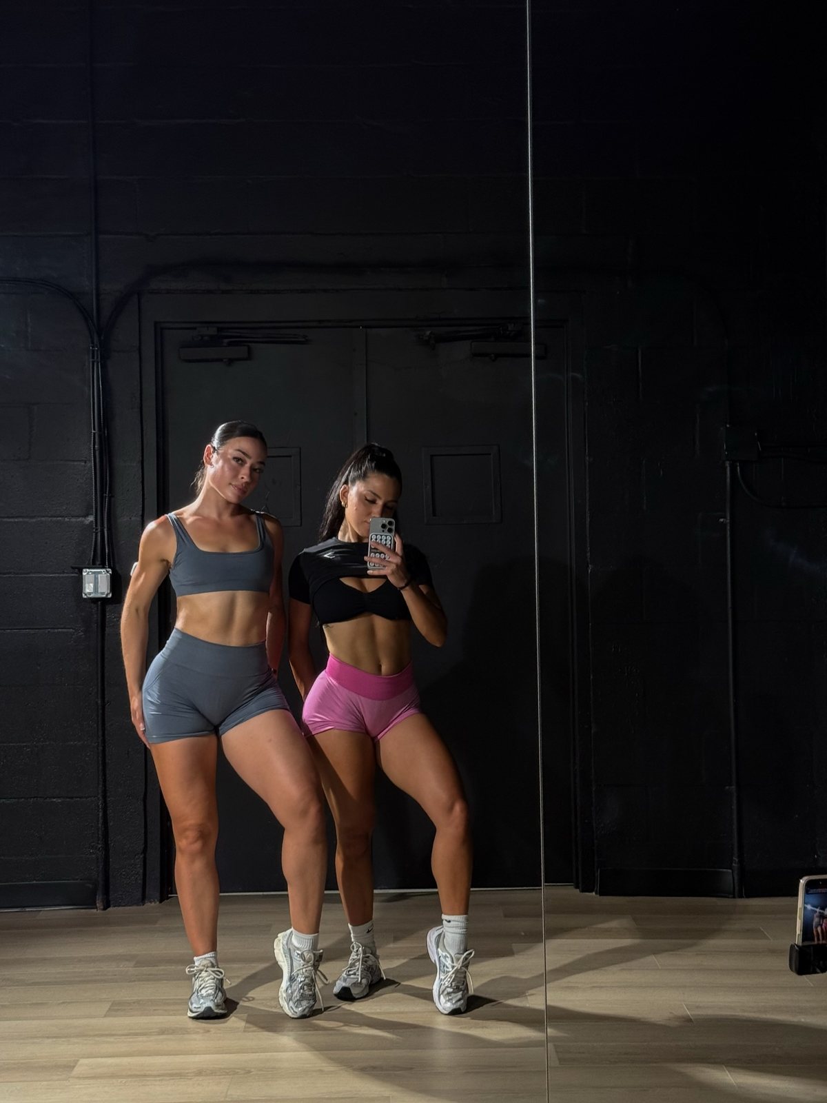 Jenny and a training partner at the gym mirror